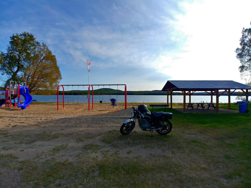 playground and picnic area at Foster's Lake with motorcycle