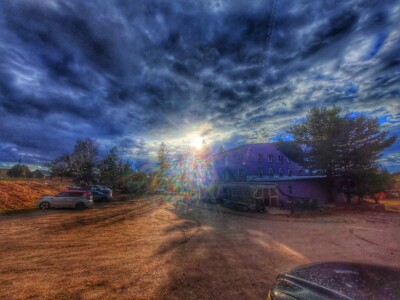 sunburst through clouds over Arlington parking lot